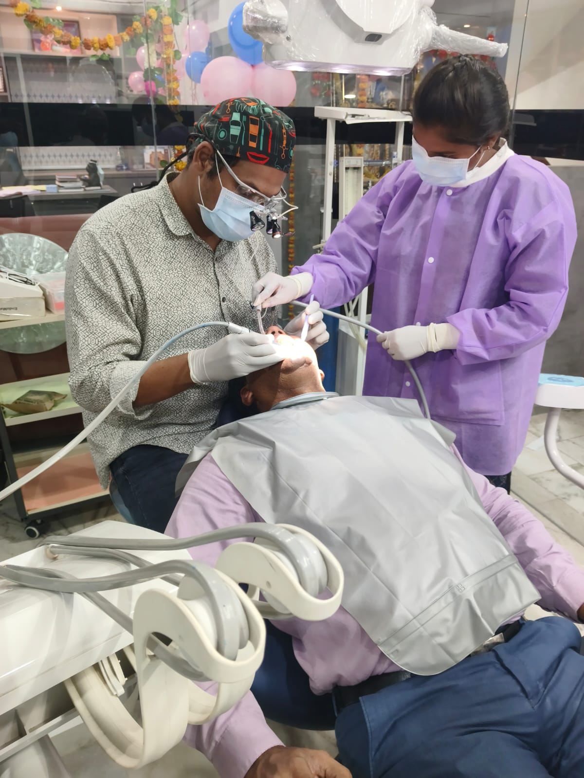 Dr. Balaji Gupta performing dental implant procedure